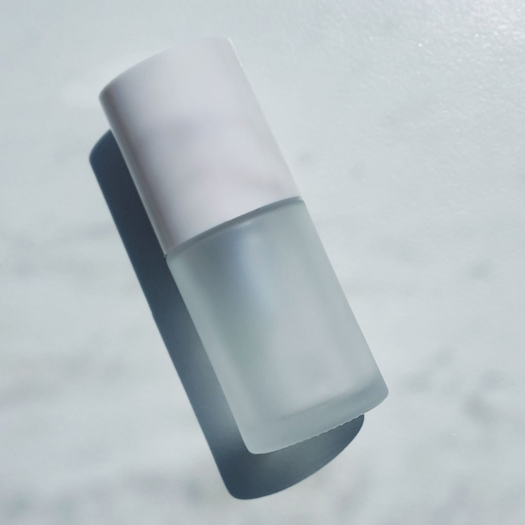 Round 1oz frosted glass bottle for private label skincare for estheticians. Ataliene Private Label