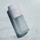 Round 1oz frosted glass bottle for private label skincare for estheticians. Ataliene Private Label