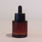 Amber glass dropper bottle 1 oz with black cap for professional private label skincare