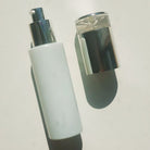 pearl white bottle with silver pump.  silver cap off - Ataliene Private Label Skincare with medical grade look