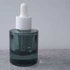 D10: Heavy Wide - Green Semi-Transparent Glass Bottle with White Dropper - Ataliene Skincare Private Label